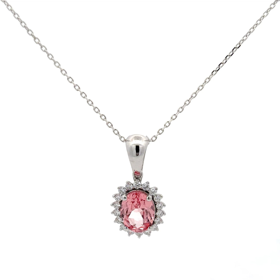 Pink gemstone pendant on a silver chain against a white background