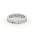 Silver ring with embedded diamonds on a white background