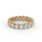 Gold ring with diamond stones on a white background