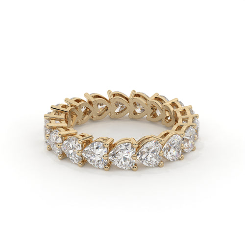 Gold ring with diamond stones on a white background