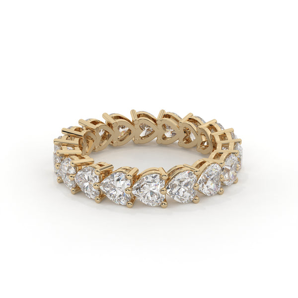 Gold ring with diamond stones on a white background