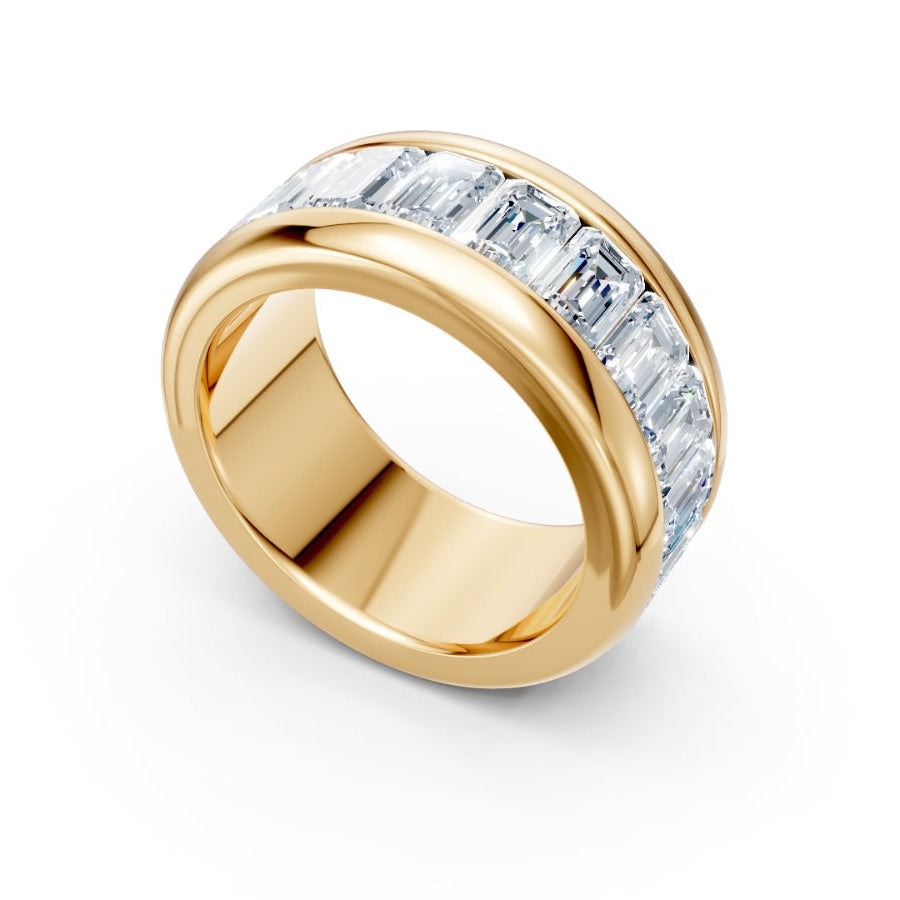 Gold ring with diamond accents on a white background