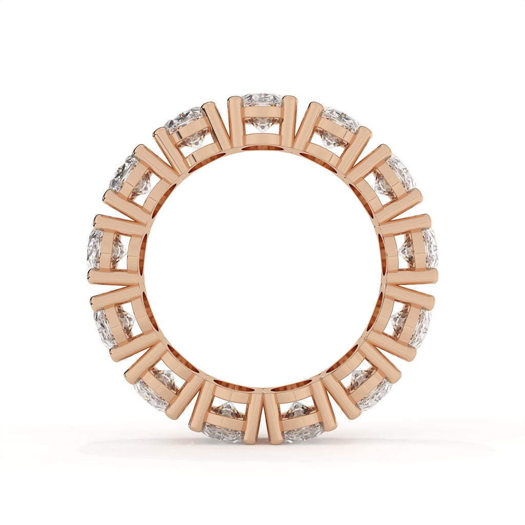 Rose gold ring with diamond accents on a white background