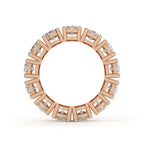 Rose gold ring with diamond accents on a white background