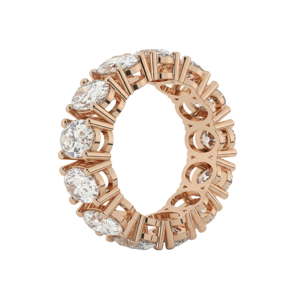 Rose gold ring with diamonds on a white background