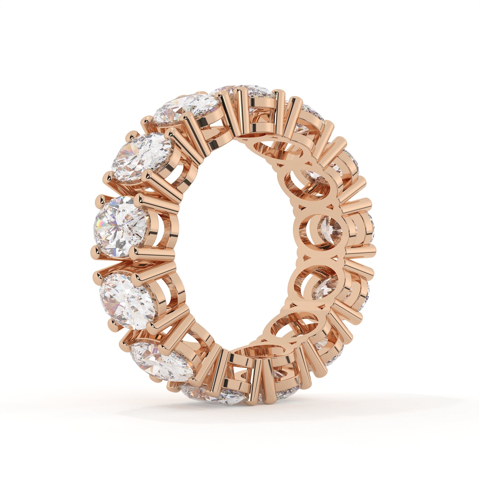 Rose gold ring with diamonds on a white background