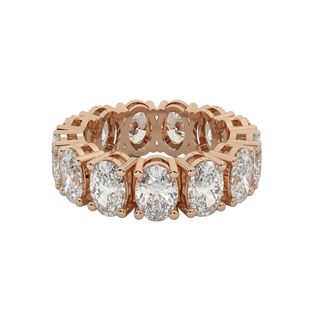 Rose gold ring with diamonds on a white background