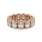 Rose gold ring with diamonds on a white background