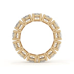 Gold ring with diamond accents on a white background