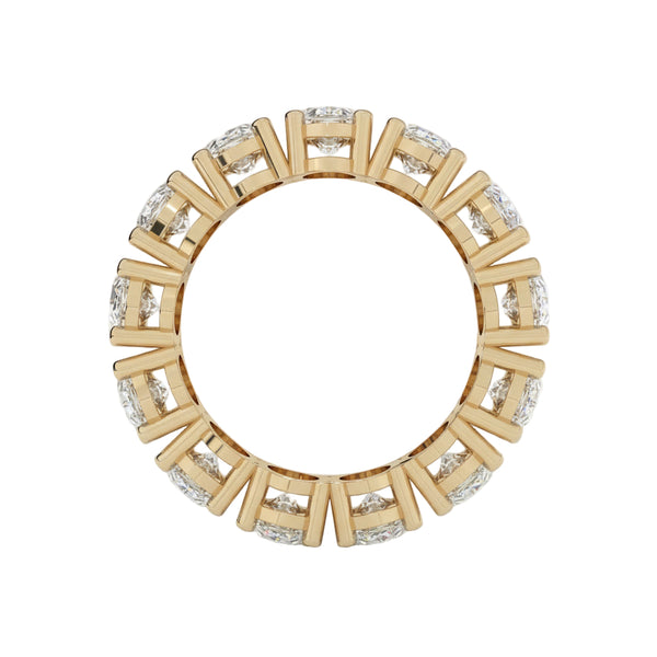 Gold ring with diamond accents on a white background