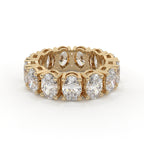 Gold ring with diamonds on a white background