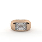 Rose gold ring with a large diamond on a white background