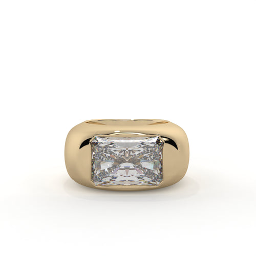 Gold ring with a large diamond on a white background