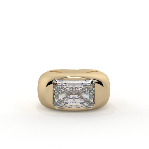 Gold ring with a large diamond on a white background
