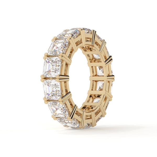 Gold ring with diamond accents on a white background