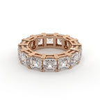 Rose gold ring with diamond accents on a white background