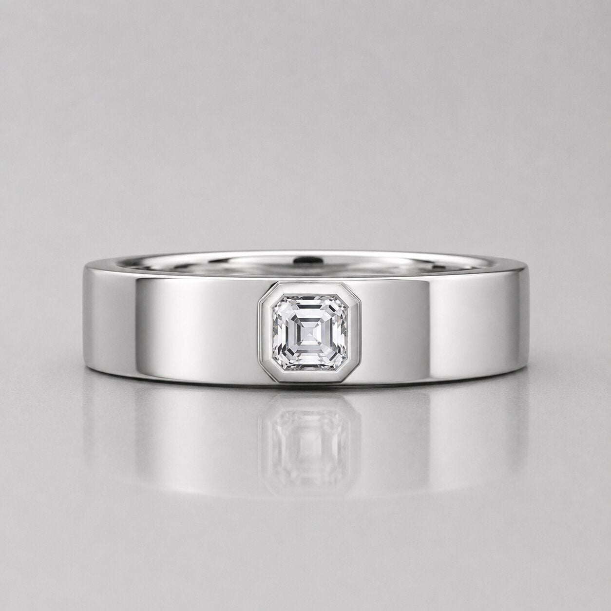 Asscher cut lab grown diamond solitaire engagement ring for men featuring a polished white gold band and a centered Asscher diamond in a sleek bezel-style setting.