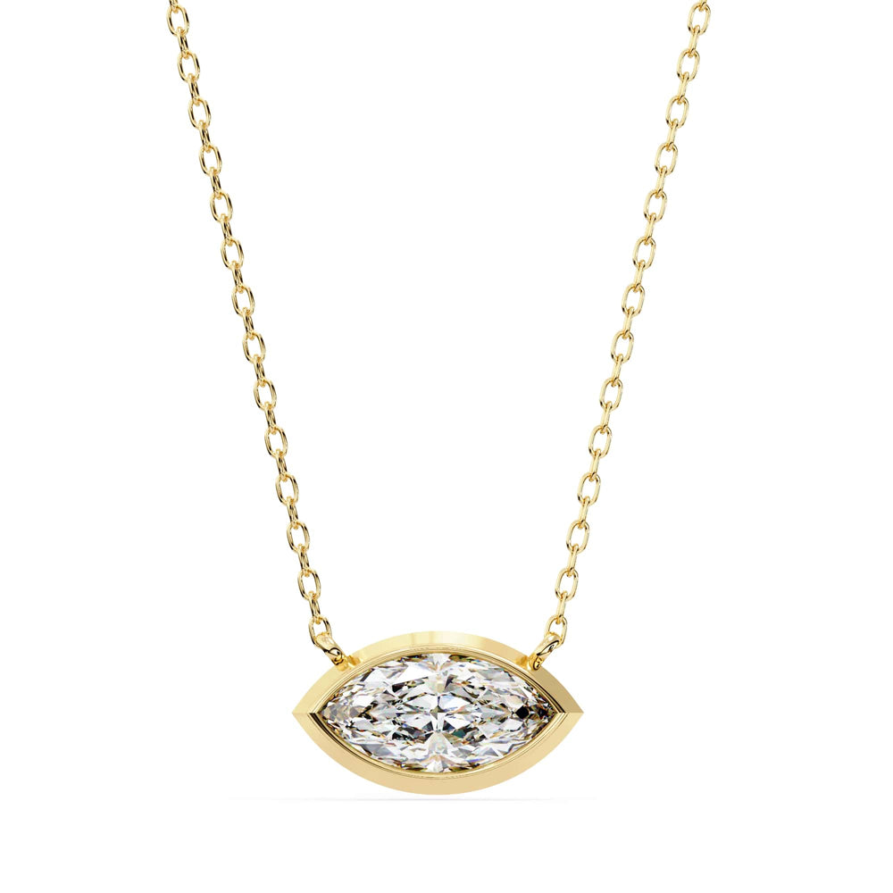Gold necklace with a diamond pendant on a white background
