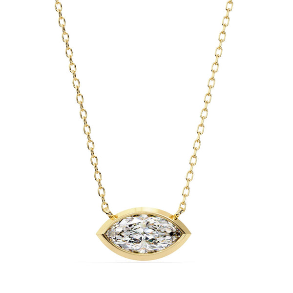 Gold necklace with a diamond pendant on a white background