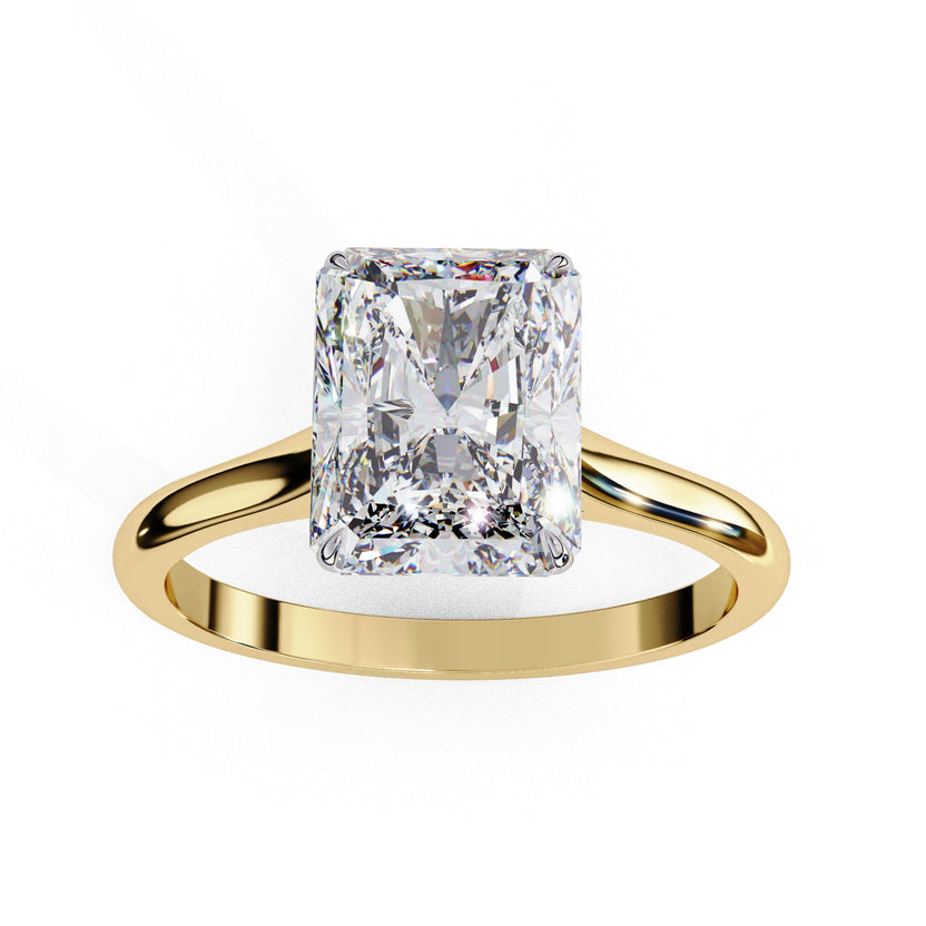 Radiant-cut diamond solitaire ring for a woman with a 14kt yellow gold band.