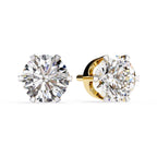 Pair of diamond stud earrings on a white background