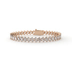 Rose gold bracelet with baguette diamonds on a white background