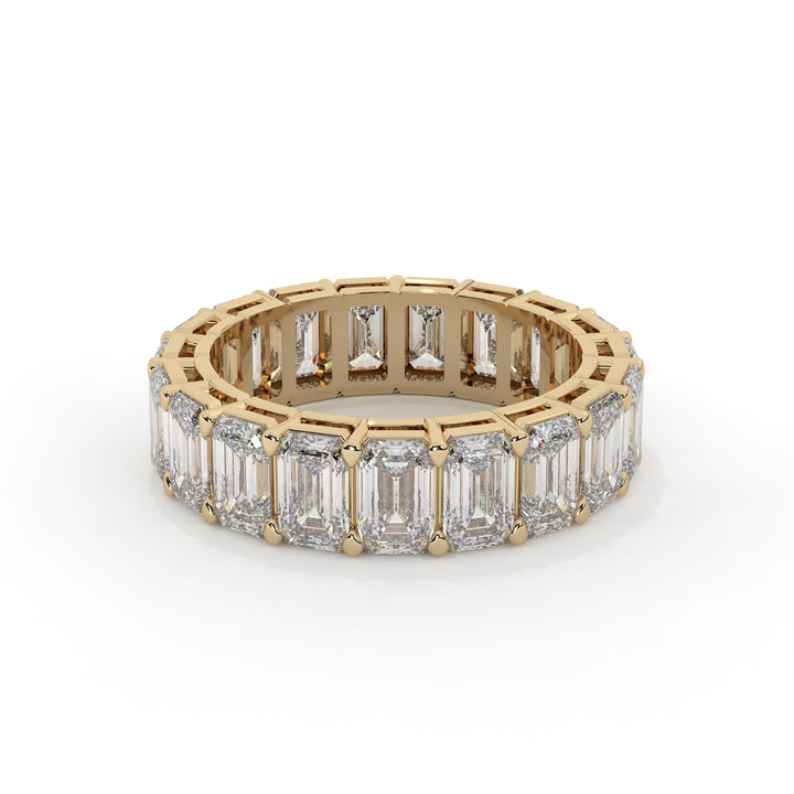 Emerald cut diamond eternity ring featuring a prong setting on a plain background.