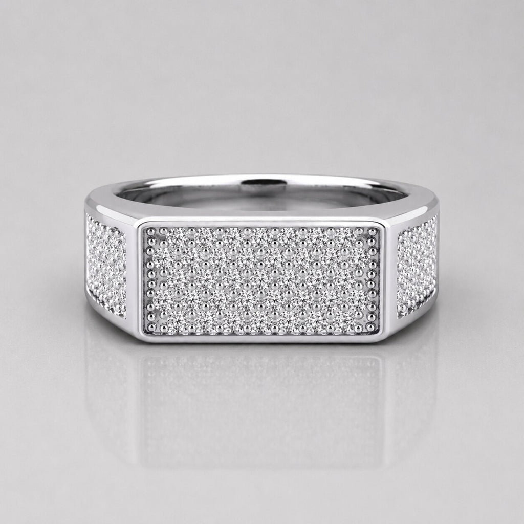 Silver ring with diamond accents on a light gray background