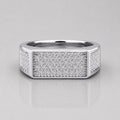 Silver ring with diamond accents on a light gray background