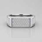 Silver ring with diamond accents on a light gray background
