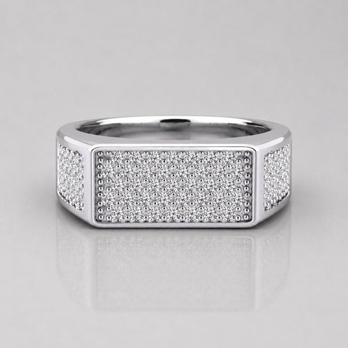 Silver ring with diamond accents on a light gray background