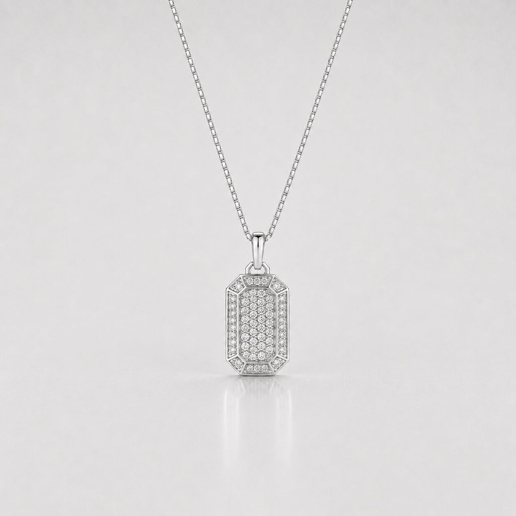 Silver pendant necklace on a light gray background