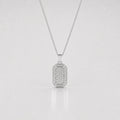 Silver pendant necklace on a light gray background
