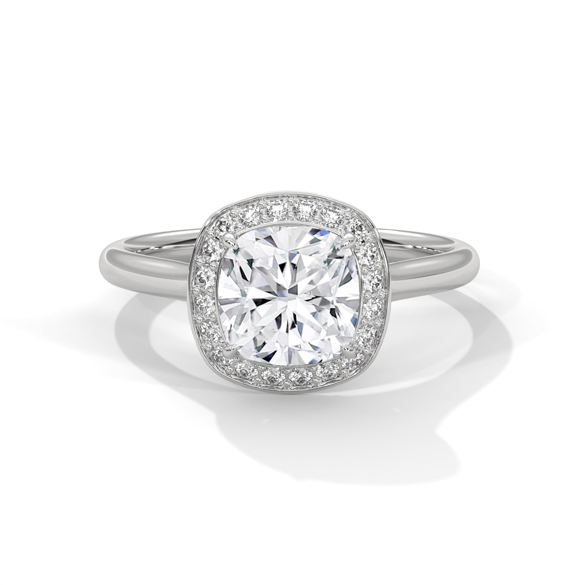 Diamond ring with a halo on a white background