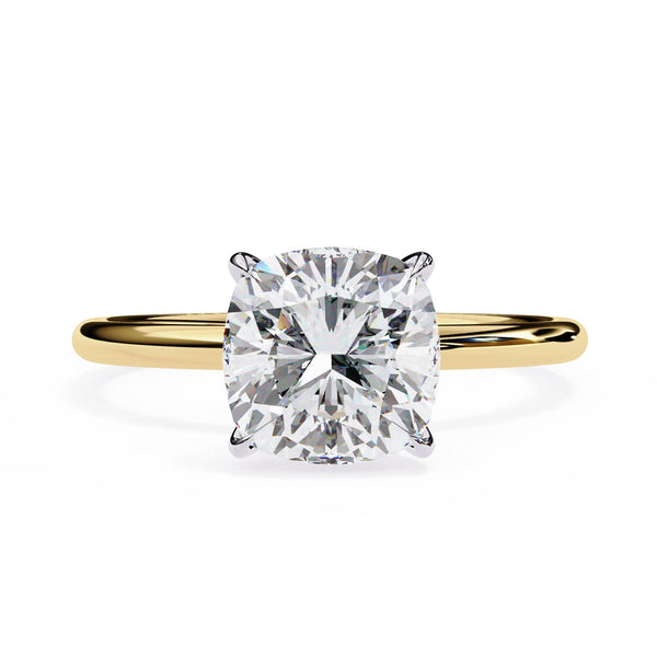Gold ring with a large diamond on a white background