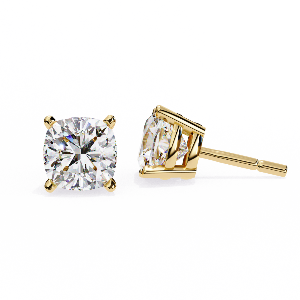 Gold stud earrings with clear gemstones on a white background