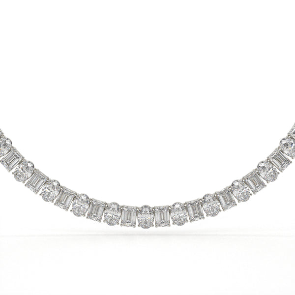 Diamond necklace with baguette and round cut diamonds on a white background