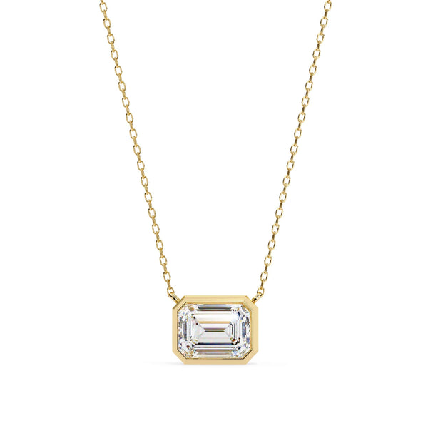 Gold necklace with a rectangular diamond pendant on a white background