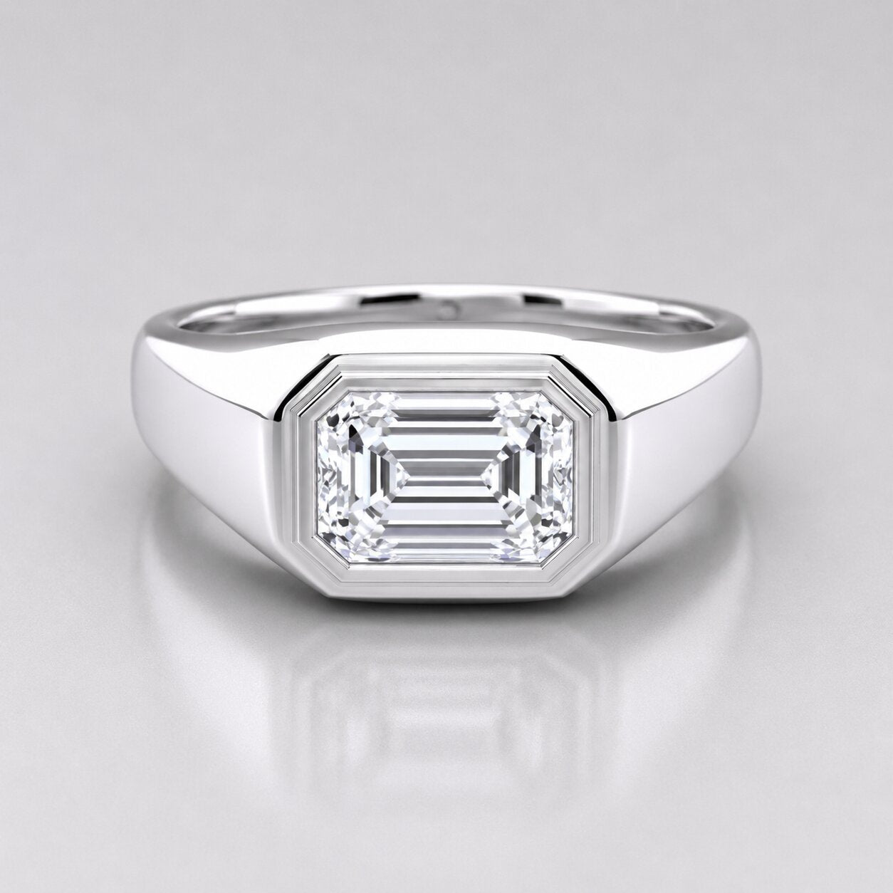 Silver ring with a large diamond on a gray background