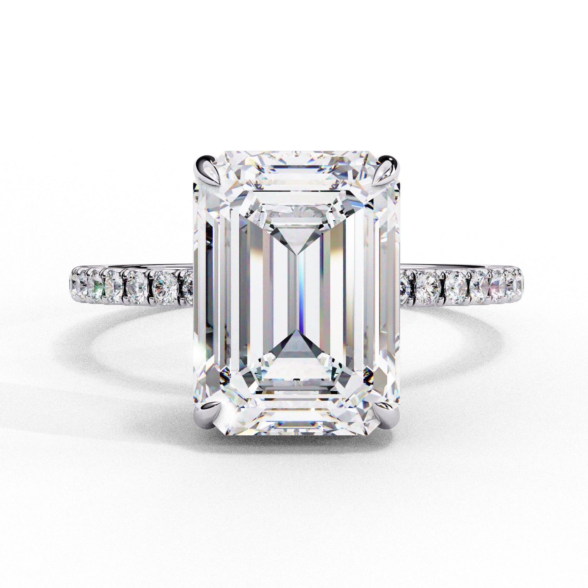 An emerald diamond hidden halo ring for woman in 18kt white gold.
