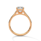 Rose gold ring with a diamond on a white background
