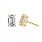 Gold emerald-cut stud earrings on a white background