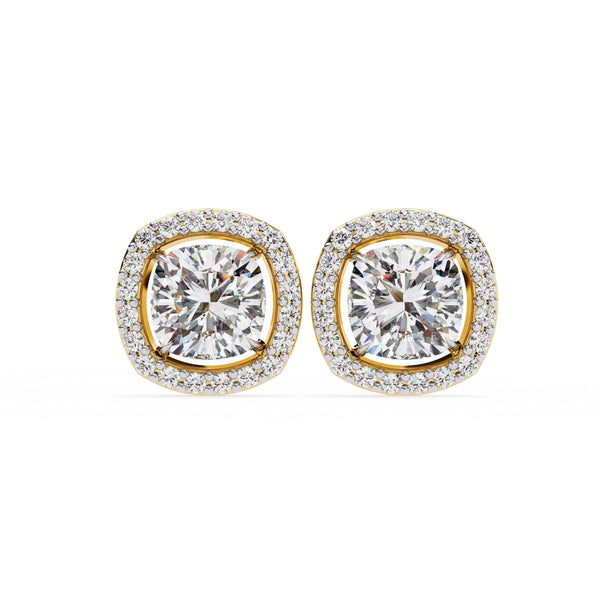 Pair of gold and diamond earrings on a white background