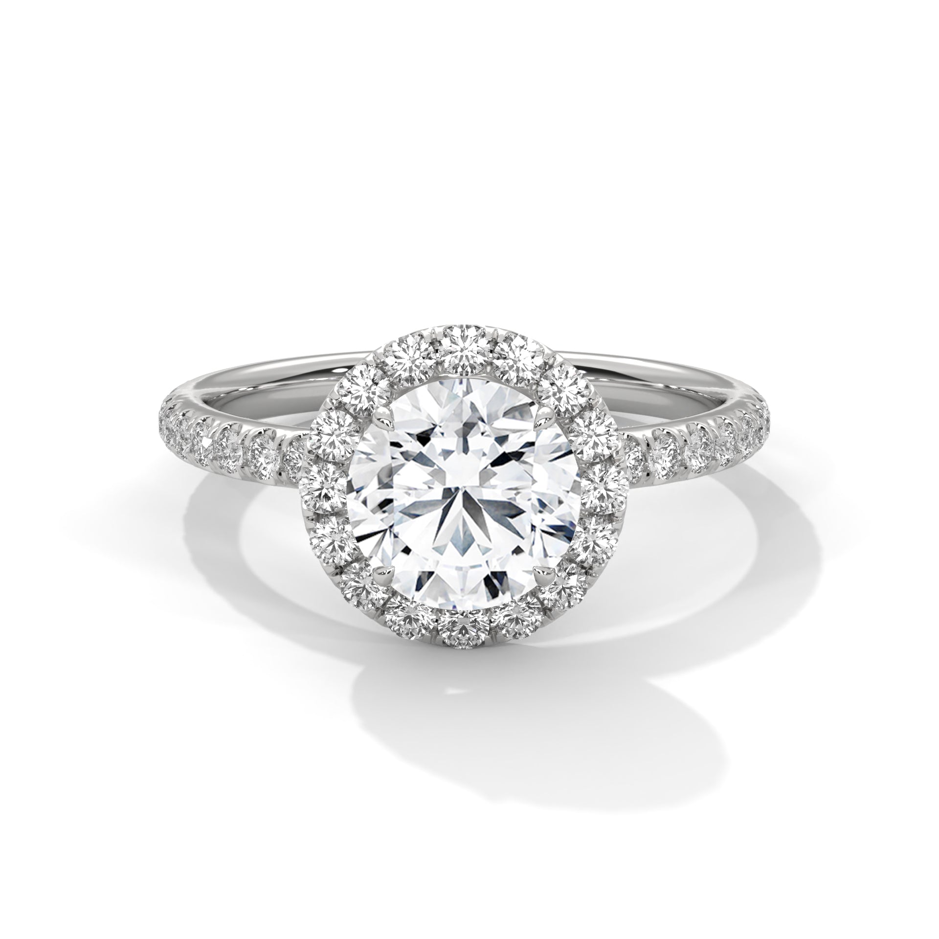 Diamond ring with a halo on a white background