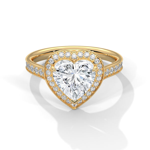Gold ring with a heart-shaped diamond on a white background