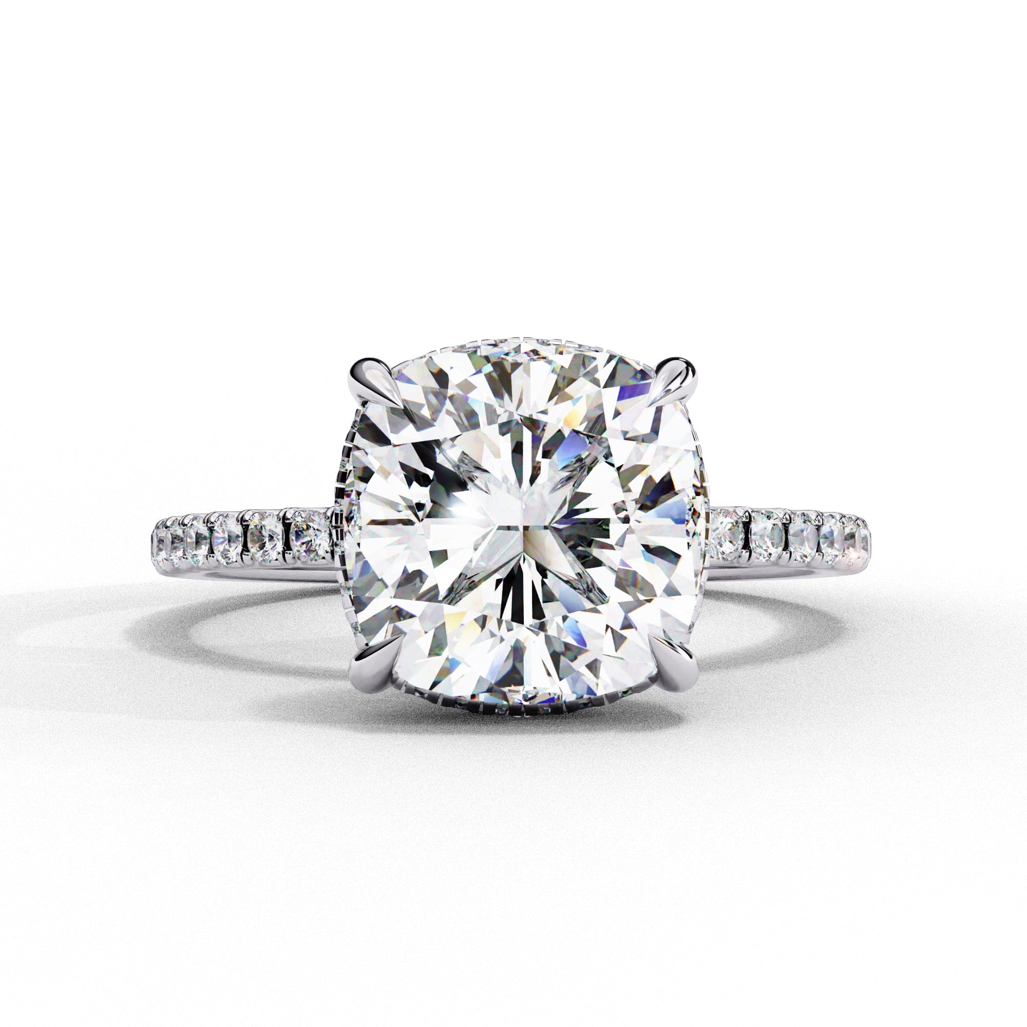 Diamond ring with a large central gemstone and smaller stones on a white background