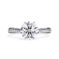 Diamond ring with a large central gemstone on a white background