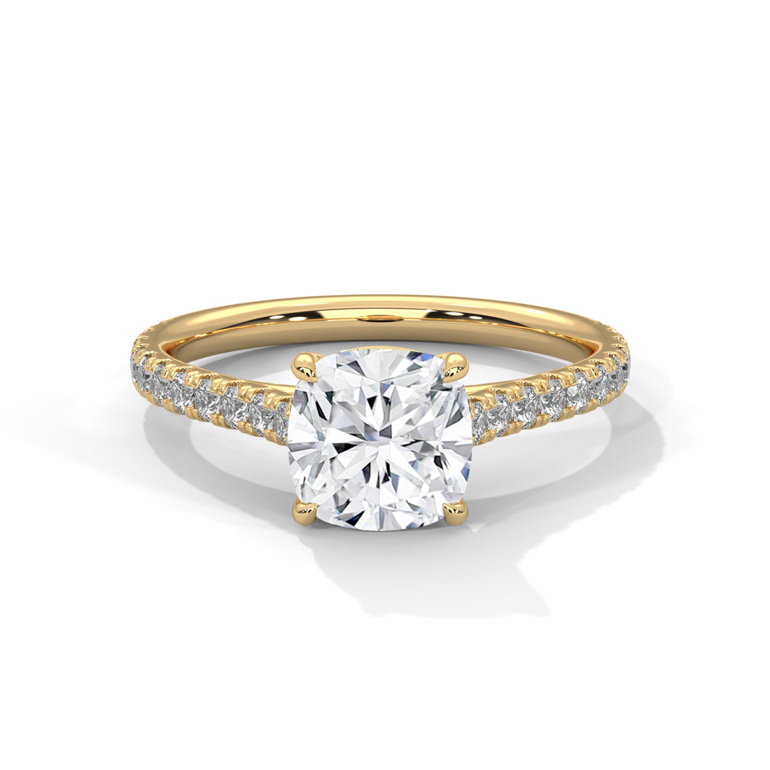 Gold ring with a large diamond and smaller diamonds on the band against a white background