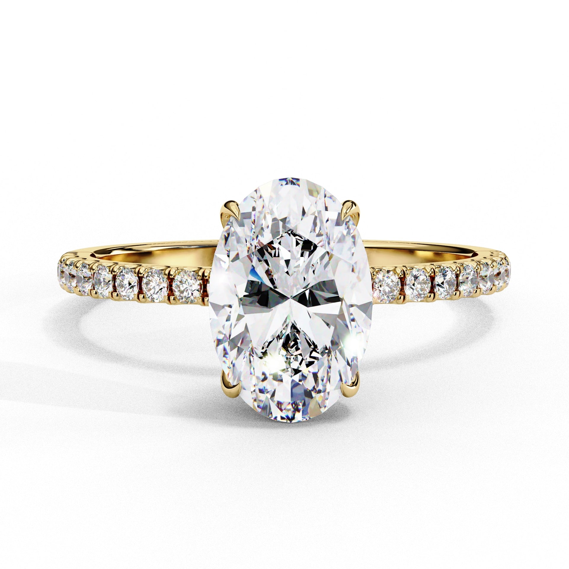 Gold ring with a large diamond and smaller diamonds on the band against a white background