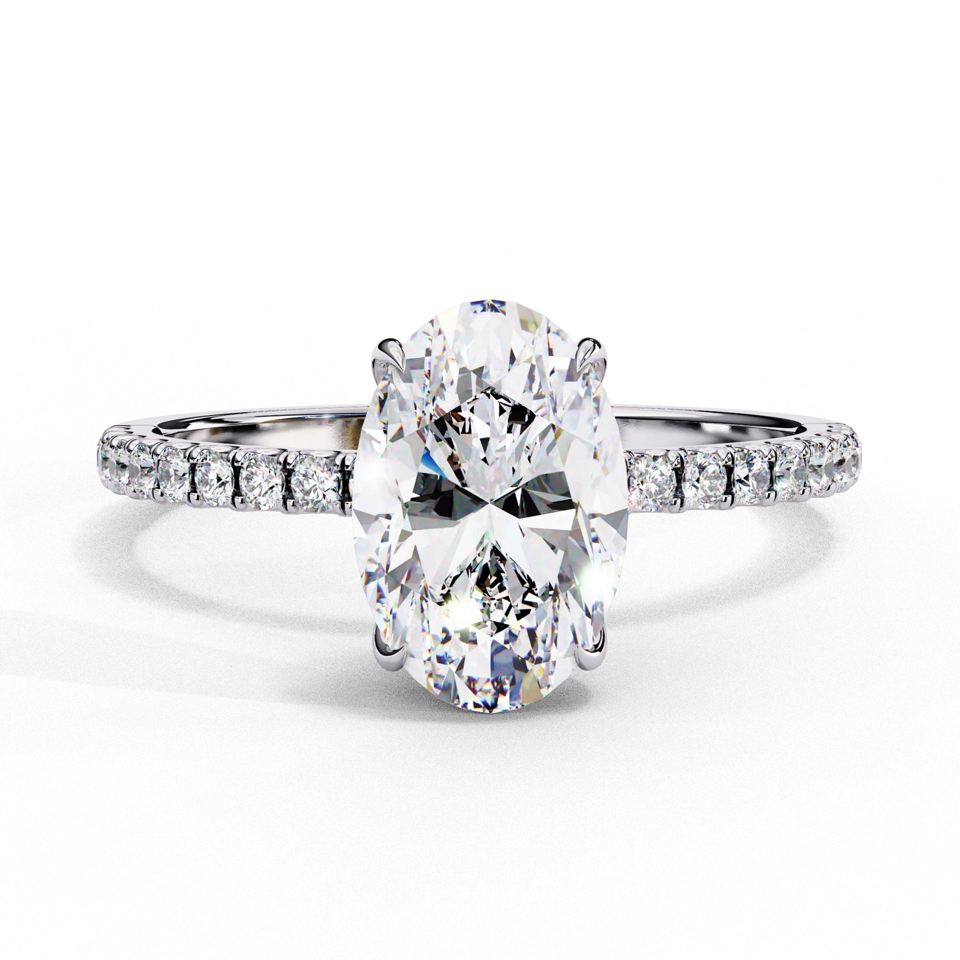Diamond ring with a pear-shaped center stone on a white background